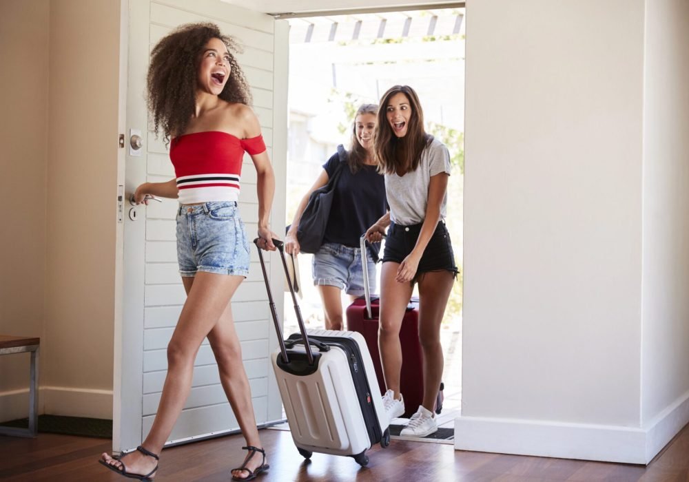 Friends Arriving at a Palm Springs Vacation Rental Group of female friends arriving at a Palm Springs vacation rental