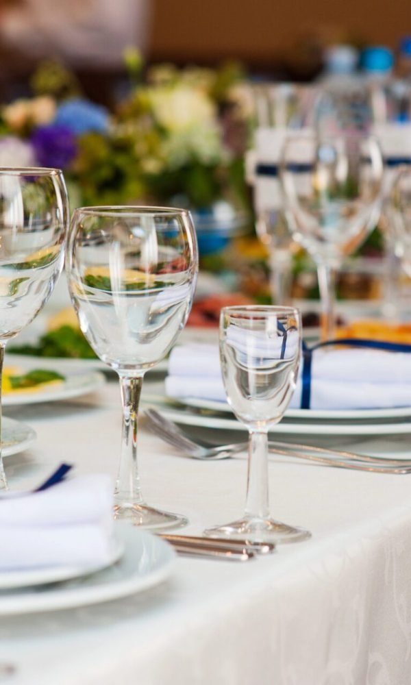 Wedding table served and decorated for a reception dinner